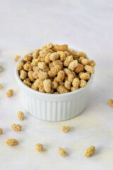 dried mulberry on wooden background - kuru dut