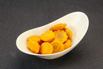 Marinated yellow patisson in the bowl