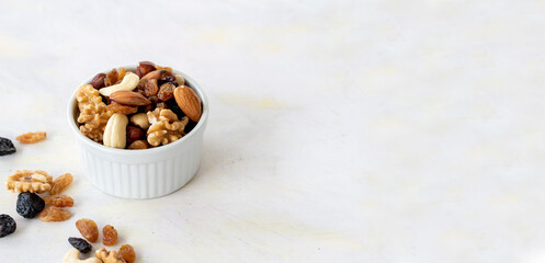 mixed nuts in bowl - on white background - copy space