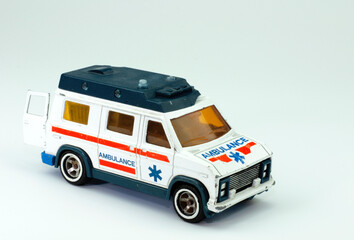 Old toy ambulance car isolated on white background  © Cglyn