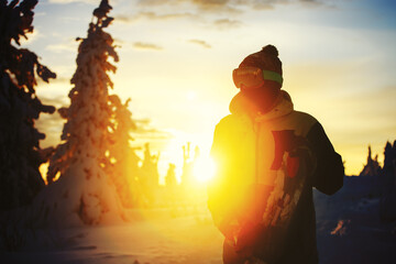 Snowboarder in backlight sunset. Ski resort Sheregesh.