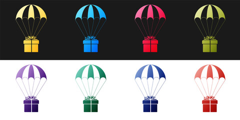 Fototapeta na wymiar Set Gift box flying on parachute icon isolated on black and white background. Delivery service, air shipping concept, bonus concept. Vector.