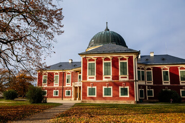 Veltrusy Rococo castle with park and garden, Romantic baroque chateau red with white windows in...