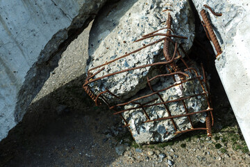 A fragment of a reinforced concrete pile after dismantling a dilapidated building. Close-up