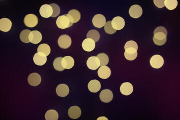 Golden bokeh background. Colored bright blurred texture of lights.