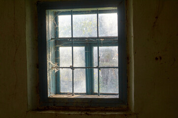 Light in the window in an old clay house