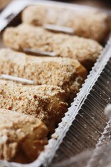 
Delicious eclairs with vanilla cream close up