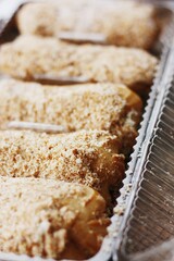 
Delicious eclairs with vanilla cream close up