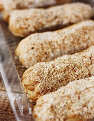 
Delicious eclairs with vanilla cream close up