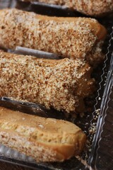 
Delicious eclairs with vanilla cream close up
