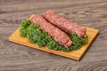 Raw minced beef kebab skewer