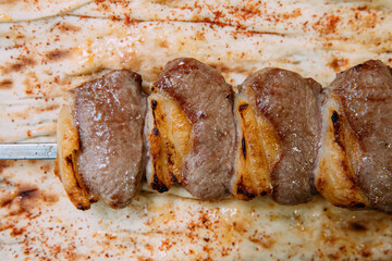 Skewers of grilled shish kebab or barbecued shashlik meat. 