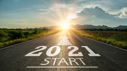 New year 2021 or start straight concept.word 2021 written on the road in the middle of asphalt road...