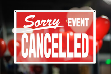 Big red cancelled sign covers decorated room for St Valentine's Day celebration, precautions during a pandemic, combating covid virus, social distancing