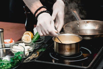 hands of chef making healthy fresh fajitas or fajitos with beef. Easy, but tasty, healthy. National Mexican food, fresh oganic food.