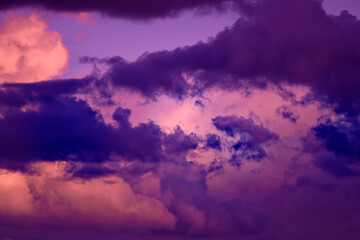 Gorgeous dramatic sunset sky with pink and purple clouds.
