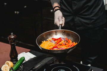 hands of chef making healthy fresh fajitas or fajitos with beef. Easy, but tasty, healthy. National Mexican food, fresh oganic food.