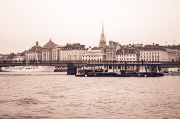 Scenic panorama of the old town, boats, bridge in Stockholm, Sweden. Toned image