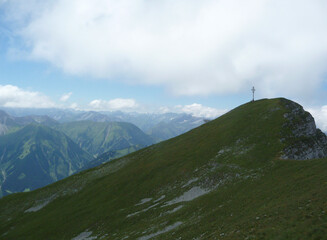 Summit cross of Kohlbergspitze mountain in Tyrol, Austria