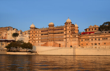 Panoramic view of the Udaipur City Palace Complex from lake Pichola in Rajasthan, India