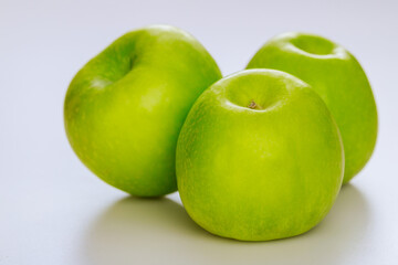 Green apples isolated on white background.