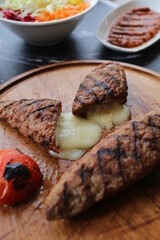 Meatballs with cheese on wooden floor - grill - kasarli kofte - kofta