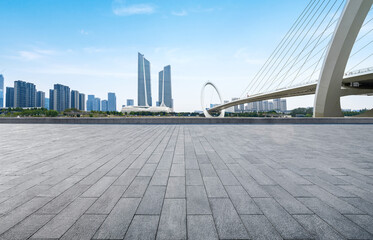 Empty plaza floor and Nanjing Eye Pedestrian Bridge in Nanjing, China