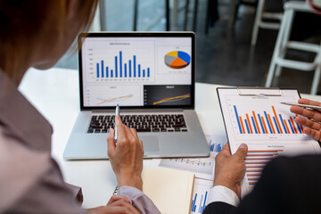 Team of business people working together in the meeting room office,
teamwork background charts and graphs banner, double exposure successful teamwork,business planning concept.
