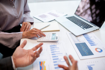 Team of business people working together in the meeting room office,
teamwork background charts and graphs banner, double exposure successful teamwork,business planning concept.
