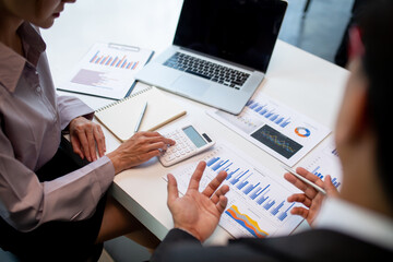 Team of business people working together in the meeting room office,
teamwork background charts and graphs banner, double exposure successful teamwork,business planning concept.
