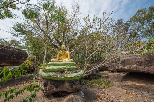 A Buddha image sitting on a Naga at Wat Phra That Buabok, Ban Phue District, Udon Thani Province, Thailand