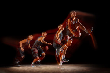 Flying. Young east asian basketball player in action and motion jumping in mixed strobe light over...