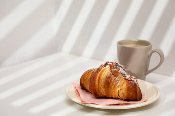 Homemade almond croissant and coffee - 394702186