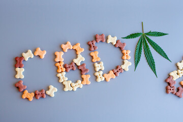 CBD lettering written from dog or cat food. CBD cannabis or hemp content in pet treats