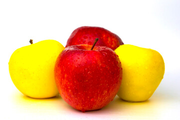 Apples on a white background with water droplets.