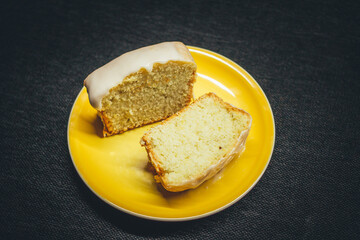 Slices of lemon bread on cute yellow plate.
