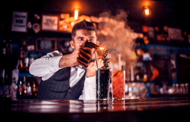 Bartender makes a cocktail in the beerhouse