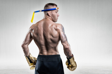 Portrait of a Thai boxer. Back view. Mixed martial arts concept.