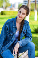 Obraz premium young beautiful brunette girl in summer park