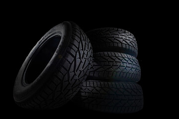 Car tire on black background