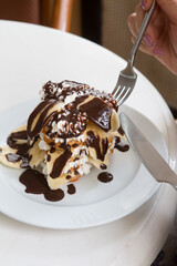 Sweet pancakes with chocolate and bananas