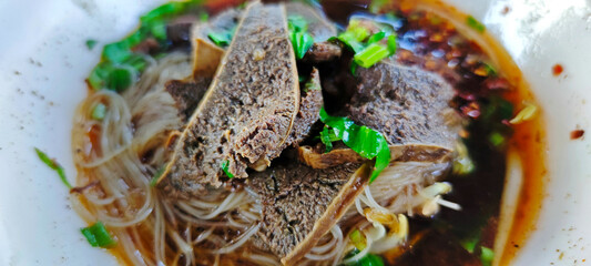 Spicy rice noodles with braised beef spleen soup.