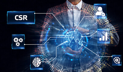 The concept of business, technology, the Internet and the network. A young entrepreneur working on a virtual screen of the future and sees the inscription: CSR