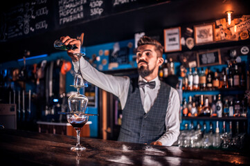 Bartender concocts a cocktail on the porterhouse