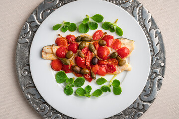 Fresh baked fish with cherry tomatoes