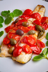 Fresh baked fish with cherry tomatoes