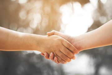 concept health care and lifestyle,people handshake at outdoor.