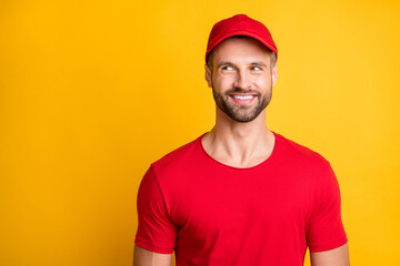 Photo of positive young guy white shiny smile look empty space wear red t-shirt cap isolated yellow color background