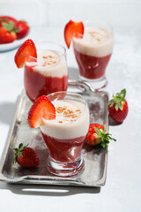 strawberry yoghurt milkshake on a tray, top view