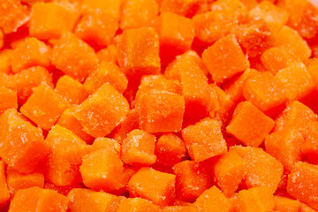 Top view of frozen diced carrots close up